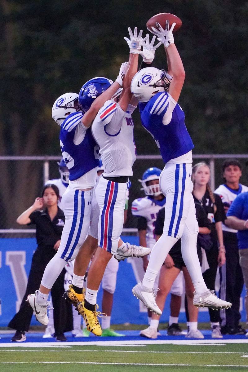 Geneva’s Dane Turner (right) intercepts a pass intended for Larkin’s Aden Mora (9) during a football game at Geneva High School on Friday, Aug 30, 2024.