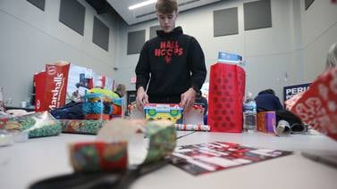 Photos: Volunteers wrap gifts for Blue and Red Christmas for Kids in Peru