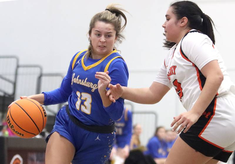 McHenry’s Maritza Martinez guards  Johnsburg’s Lauren McQuiston, left, in varsity girls basketball on Saturday, Jan. 4, 2025, at McHenry High School in McHenry.