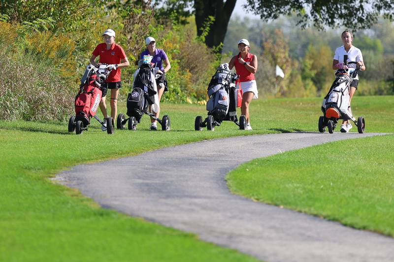 Bradley Bourbonnais' Allie Trudeau, Joliet Township's Sophia Podmolik, LaSalle-Peru's Sophia Chiu and Minooka's Laney Przybyla approach the 12th hole in the 2A Rich Township Regional girls golf tournament on Tuesday, Sept. 30, 2025 in University Park.