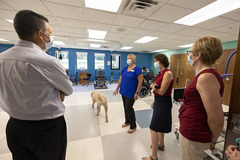 Sheila Huizenga, assistant administrator of Winning Wheels in Prophetstown, gives State Senator Win Stoller and his team a tour of the physical therapy room Tuesday, July 25, 2023.