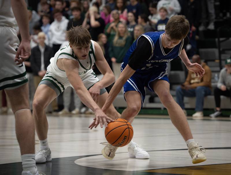 Bishop McNamara's Coen Demack, left, tries to pick the ball from Newark's Dylan Kulbartz in a game on Friday, Feb. 20, 2026.