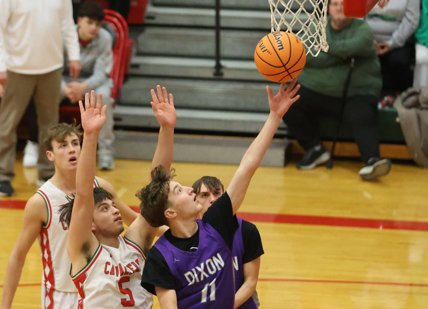 Dixon's Brody Nicklaus lets go of a shot under the hoop as L-P's Erick Sotelo guards him on Tuesday, Jan. 20, 2026 in Sellett Gymnasium at L-P High School.
