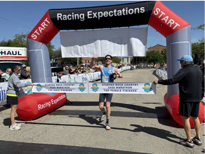 Jens Conzen breaking the tape at the Starved Rock Country full marathon on Saturday, May 9, 2026. Conzen, an Oak Park resident, finished with a time of 3:13.32, best in the field.