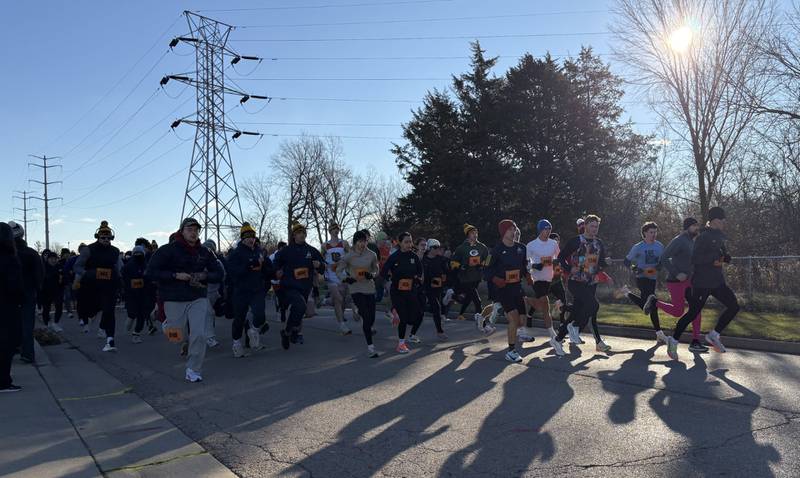 Runners bolt out of the gate at the start of the 47th annual Oglesby Turkey Trot on Thanksgiving morning at Oglesby Elks Lodge.