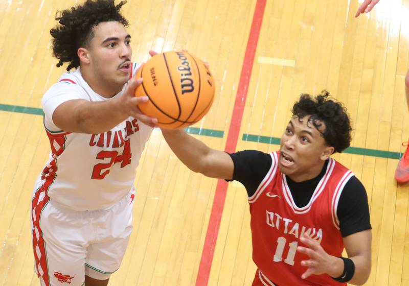 L-P's Marion Persich grabs a rebound over Ottawa's Hezekiah Joachim on Friday, Jan. 9, 2026 in Sellett Gymnasium at L-P High School.