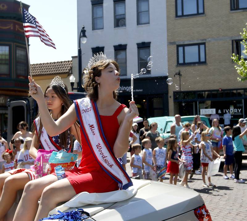 Miss Woodstock Maggie Griffin blows bubbles during the Woodstock VFW Post 5040 City Square Memorial Day Ceremony and Parade on Monday, May 29, 2023, in Woodstock.