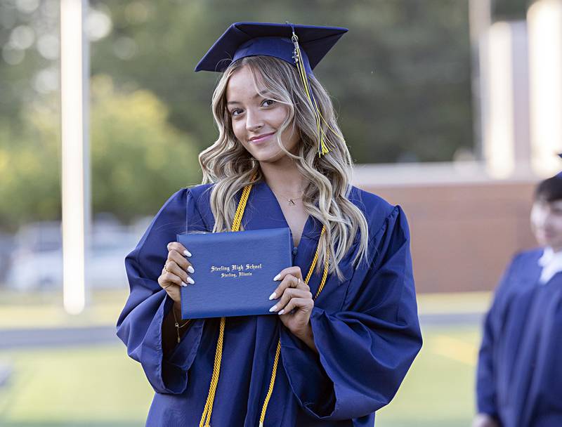 Aubrianna Menchaca poses with her diploma from Sterling during graduation Friday, May 26, 2023.