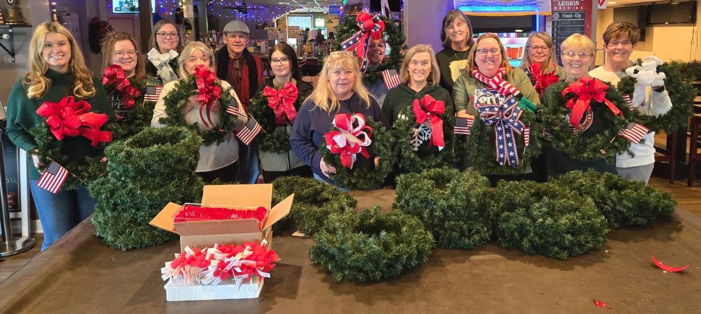 DeKalb American Legion Auxiliary members assembling veteran holiday wreaths