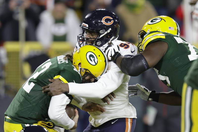 Chicago Bears' Robert Quinn sacks Green Bay Packers' Aaron Rodgers during the first half Sunday, Dec. 12, 2021, in Green Bay, Wis.