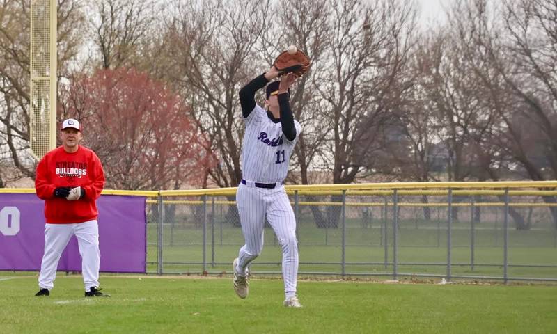 Rochelle's Brody Bruns runs down a foul ball during the Hubs' game with Streator.