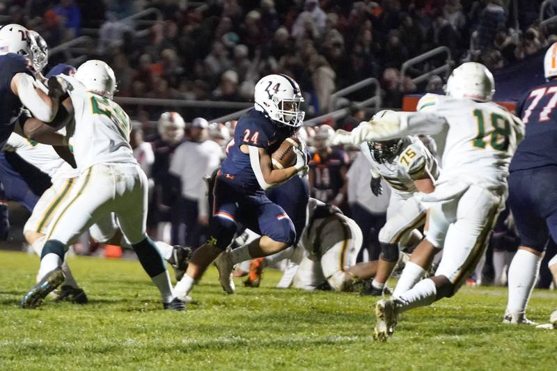 Oswego’s Ayden Villa (24) carries the ball for a touchdown against Waubonsie Valley during a Class 8A first-round playoff game at Oswego High School on Friday, Nov. 1, 2024.