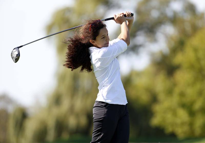 Madelyn Maldonado of Benet Academy,  watches her drive during the IHSA Class 2A West Chicago girls golf regional at St. Andrews Tuesday, Oct. 1, 2024 in West Chicago.