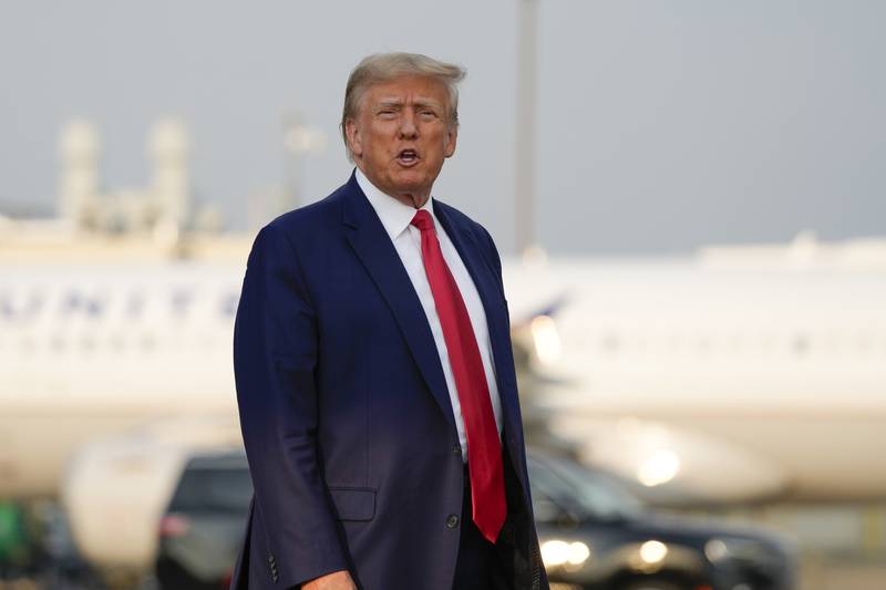 Former President Donald Trump steps off his plane as he arrives at Hartsfield-Jackson Atlanta International Airport, Thursday, Aug. 24, 2023, in Atlanta. (AP Photo/Alex Brandon)