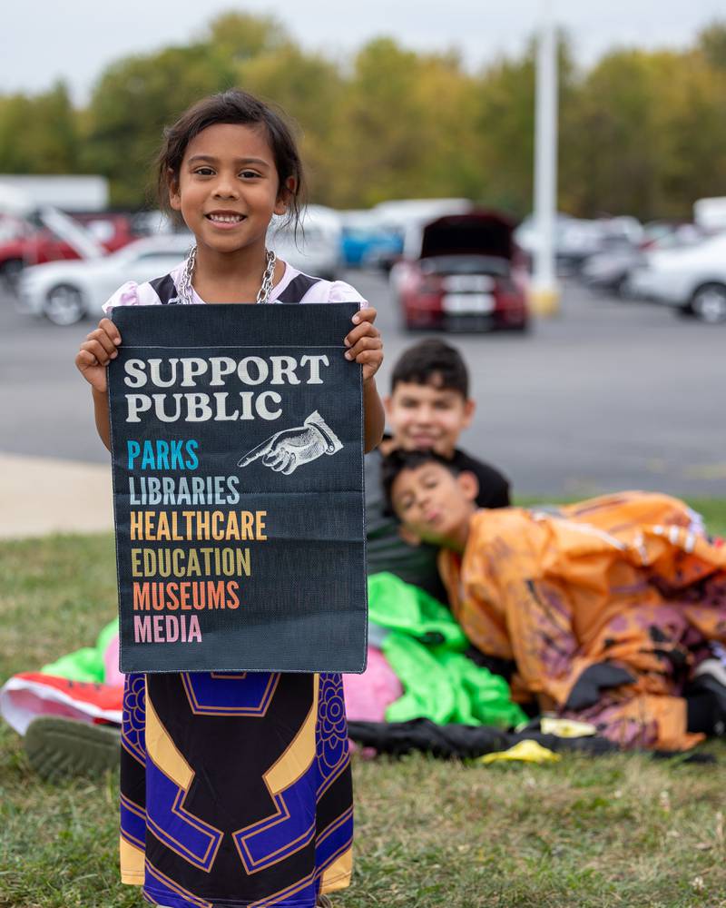 Child holds sign at the ‘No Kings 2.0’ Protest on Saturday, October 18, 2025 on North Division Street in Morris.