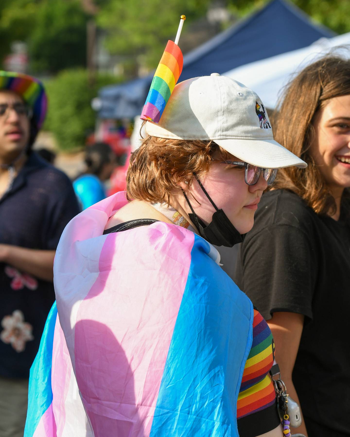 Alec Zack of DeKalb stops to look at the different venders while hanging out with friends during DeKalb Pride Fest held in downtown DeKalb on Thursday, June 22, 2023.