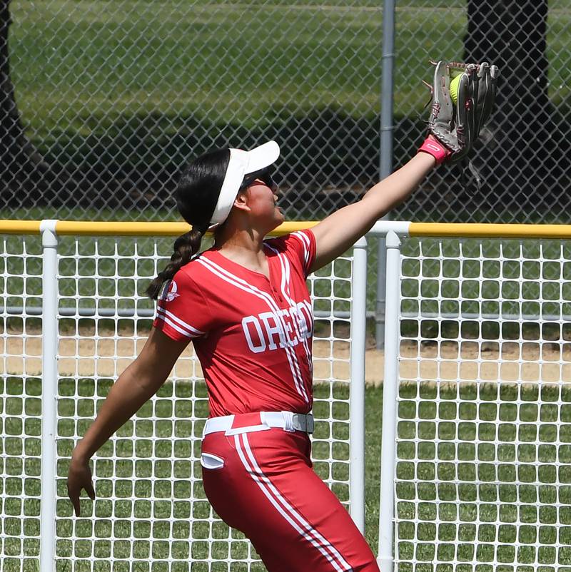 Oregon centerfielder Giselle Zavala squeezes a fly ball for an out during the championship game against Rock Falls at the 2A Oregon Regional on Saturday, May 23, 2026 at Oregon Park West.