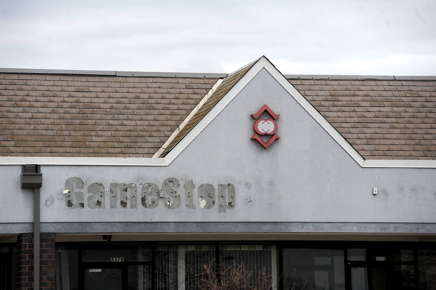 The outline of a removed store sign at the Crystal Court shopping center at 6000 Northwest Highway in Crystal Lake, is photographed on Wednesday, April 13, 2022.