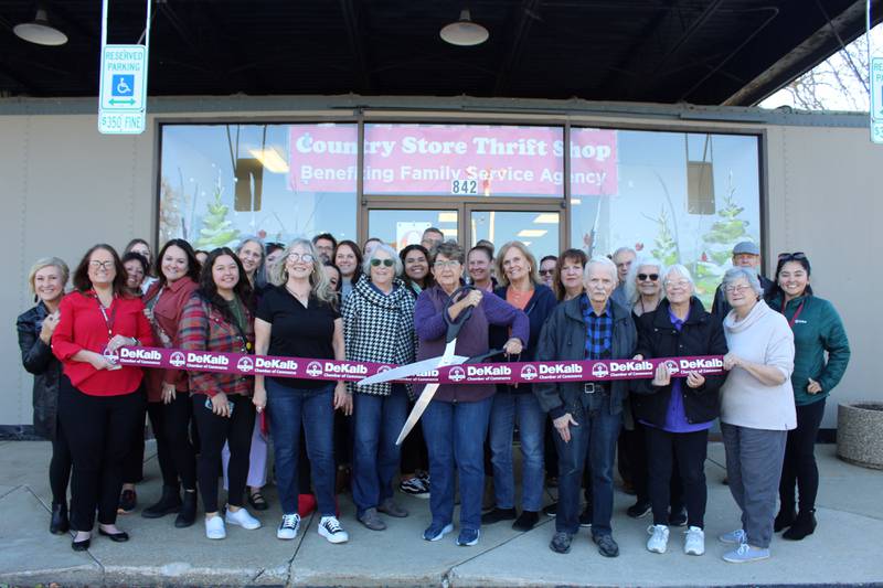 The DeKalb Chamber of Commerce celebrating The Country Store Thrift Shop's new location with a ribbon-cutting