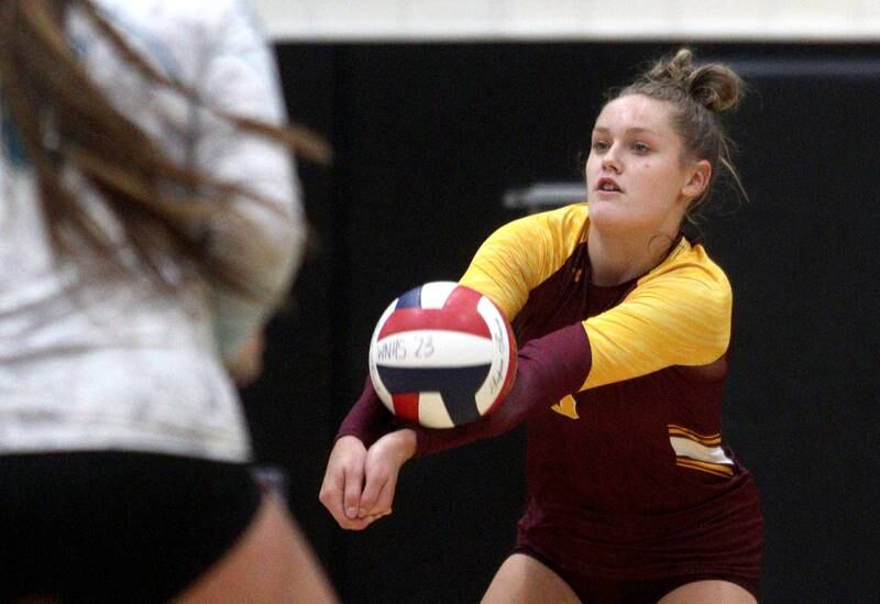 Richmond-Burton’s Elissa Furlan passes the ball in varsity volleyball at Woodstock North Monday night.