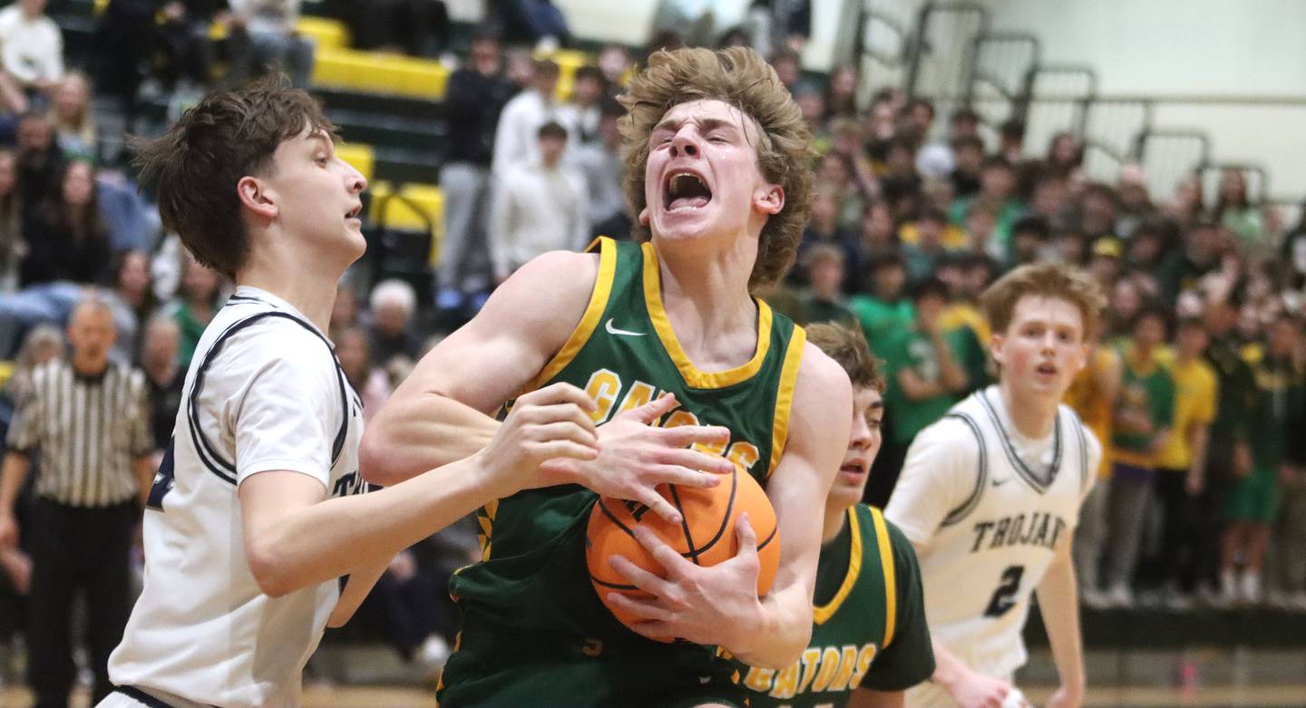 Crystal Lake South’s Carson Trivellini heads for the hoop as Cary-Grove’s Evan Bauer defends in boys IHSA Class 3A Regional Championship basketball on Friday, Feb. 27, 2026, at Crystal Lake South High School in Crystal Lake.