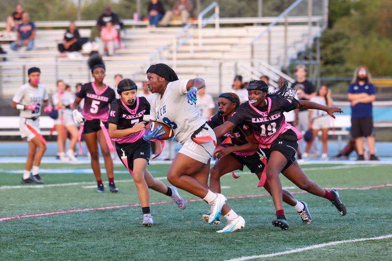 Plainfield South's Cyncere Falconer is stopped by Kankakee's London Stroud, right, during the Kays' 40-26 victory over Plainfield South on Monday, Oct. 6, 2025.