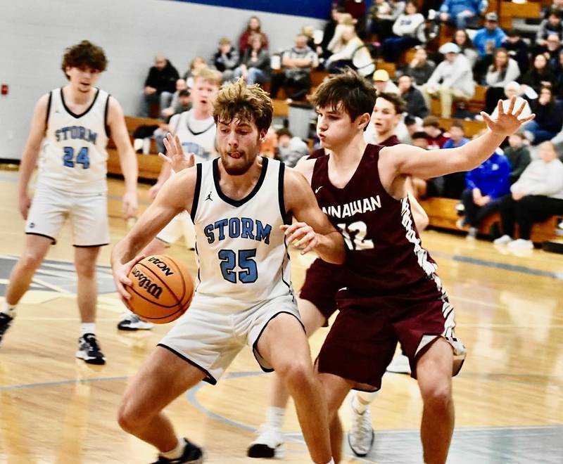 Bureau Valley's Landon Hulsing makes his moves on Annawan's Dillon Ketelson in Friday's game at the Storm Cellar. The Storm won 54-36 to take over the top spot in the Lincoln Trail Conference.