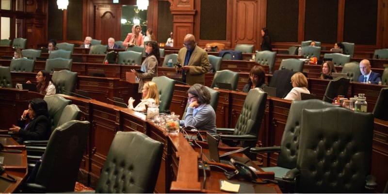 Lawmakers wait on the Illinois House floor to vote on a new transit funding plan and other measures that surfaced in the final hours of the fall veto session.