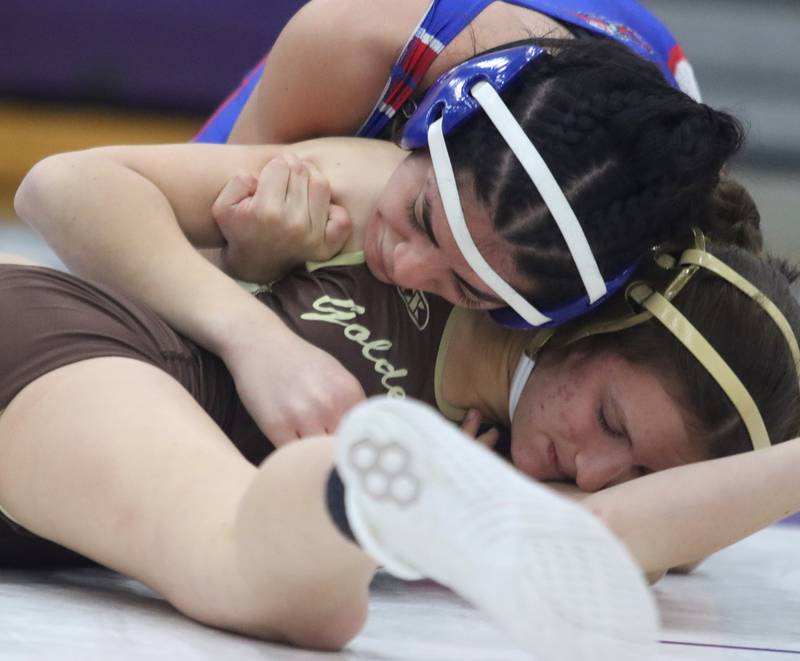 Dundee-Crown’s Diamond Rodriguez, top, battles Jacobs’ Julia Felton at 105 pounds in IHSA Regional wrestling semifinal action on Saturday, Feb. 1, 2025, at  Hampshire High School  in Hampshire.
