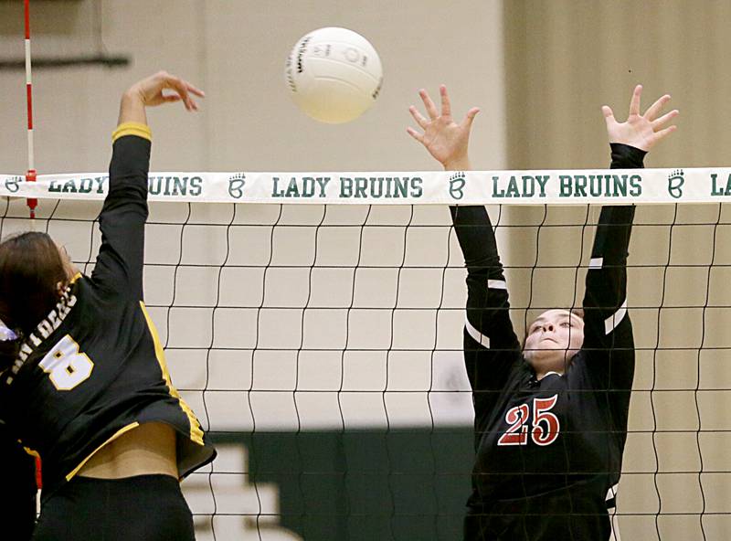 Putnam County's Ava Hatton (8) spikes the ball past Earlville's Nevaeh Sansone (25) in the Class 1A Regional game on Monday, Oct. 24, 2022 at St. Bede Academy in Peru.