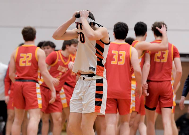 Wheaton Warrenville South's Luca Carbonaro (30) reacts to missing the the game winning basket as Batavia celebrates the victory behind him in Wheaton on Saturday, January 6, 2024.