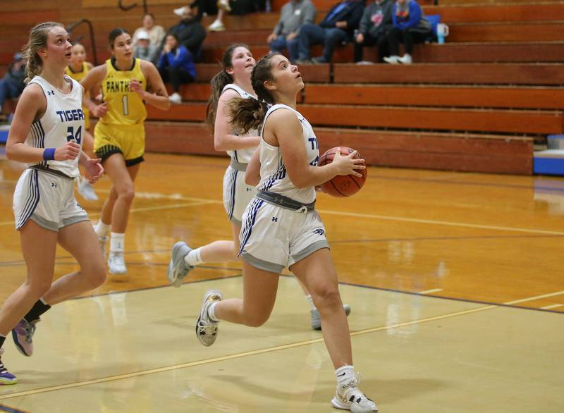 Princeton's Olivia Mattingly runs in all alone on a breakaway to score a basket against Putnam County during the Princeton High School Lady Tigers Holiday Tournament on Thursday, Nov. 16, 2023 at Prouty Gym.