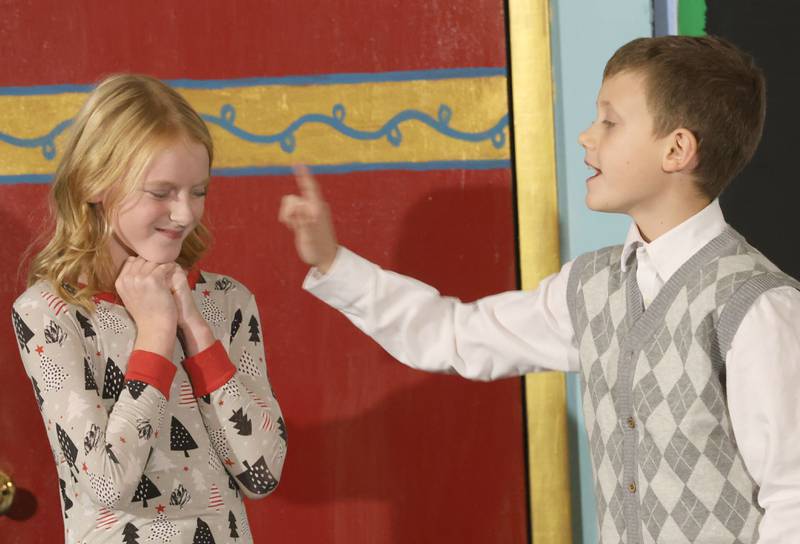 Rose Tracey as Hannah Bloom, and Maddux Bell as Mr. Bloom act out a scene with during Maddux Bell as Mr. Bloom, during a rehearsal of “The Magic of Christmas” the Children’s Christmas Musical on Tuesday, Nov. 11, 2025 at the Prairie Art’s Center in Princeton.