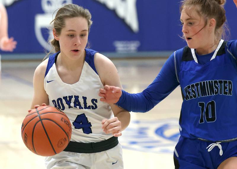 Hinckley-Big Rock's Lily Day dribbles the ball past Westminster Christian's Meadow Oesterle during their regional semifinal game Monday, Feb. 13, 2023, at Hinckley-Big Rock High School.