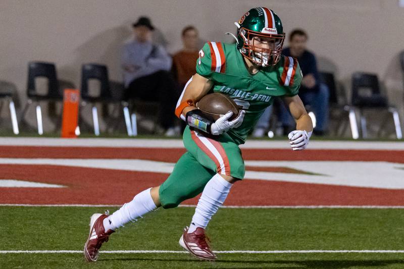 Adrian Arzola of L-P runs with ball on Friday, October 11, 2024 at Howard Fellows Stadium in LaSalle.
