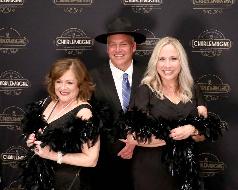 (Left to right) Suzette Turyna, Justice Parrotte and Tracy Minnec pose for a photo booth photo during the 100th Annual Charlemagne Gala at the Q Center in St. Charles on Friday, May 13, 2022.