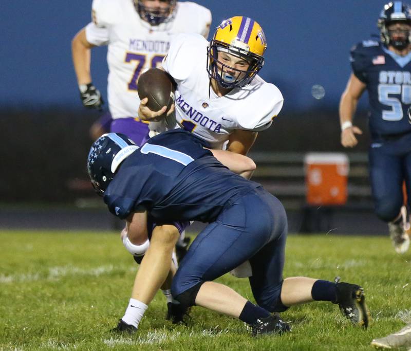Mendota quarterback Justin Randolph is hit by Bureau Valley quarterback Bryce Helms on Friday, Sept. 22, 2023 at Bureau Valley High School.