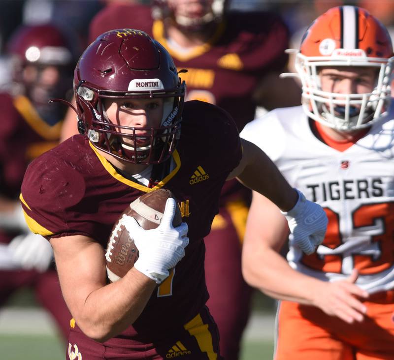 Joe Lewnard/jlewnard@dailyherald.com
Montini's Alex Marre carries the ball for a first-quarter touchdown during the Class 3A semifinal game against Byron in Lombard Saturday.