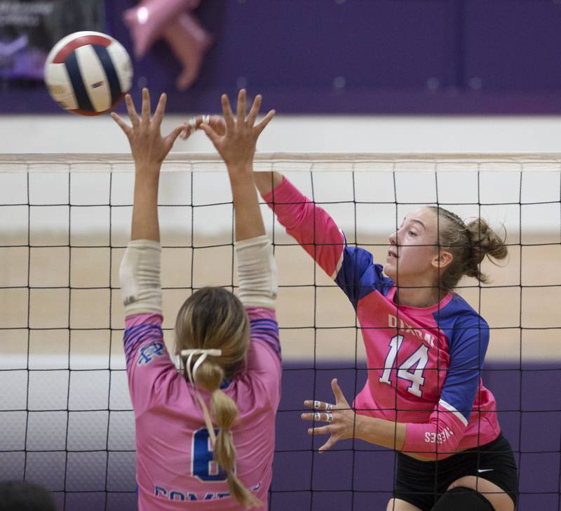 Dixon’s Leah Carlson hammers a shot against Newman’s Brooklyn Smith Thursday, Oct. 2, 2025.