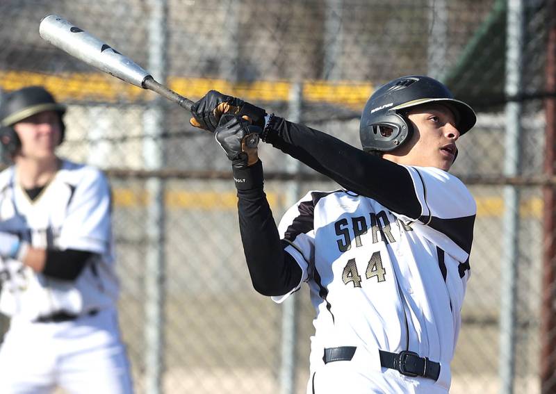 Sycamore's Tommy Townsend watches as his ball travels over the centerfield fence for a home run during their game against Harlem Monday, March 27, 2023, at the Sycamore Community Park.