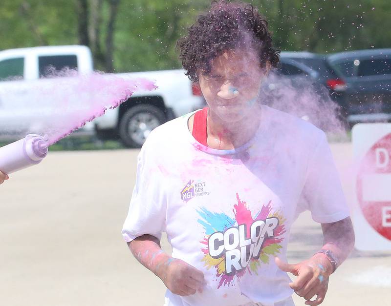 Kai Berry of Ottawa, finishes first place overall during the Color Fun Run on Sunday, April 26, 2026 at Lake Mendota.