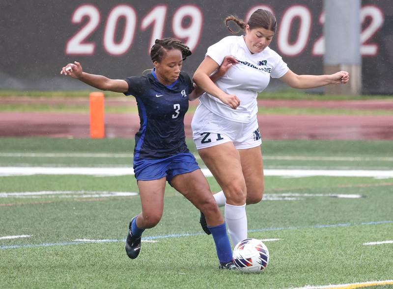 Burlington Central's Mekenzie Rogers (left) and Peoria Notre Dame's Hannah Daly fight for a loose ball during their third place game Saturday, June 1, 2024, at the IHSA Class 2A state soccer finals at North Central College in Naperville.