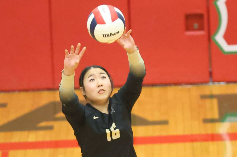 Sycamore's Inae Kim sends the ball over to Washington during the Class 3A Sectional semifinal game on Tuesday, Nov. 4, 2025 in Sellett Gymnasium at L-P High School.