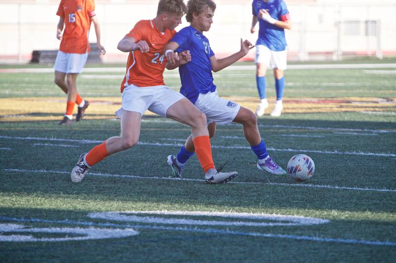 St. Charles East's Colten Pariso applies pressure to St. Charles North's Vincent Garbato on Thursday, Sept. 25, 2025 in Batavia.