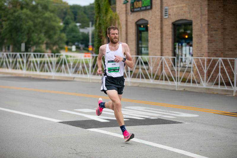 East Aurora High School cross country and track coach Shane Gillespie heads towards the finish line at the Fox Valley Marathon on Sunday, Sept. 18, 2022. Gillespie finished as the second male finisher in the half marathon portion of the race.