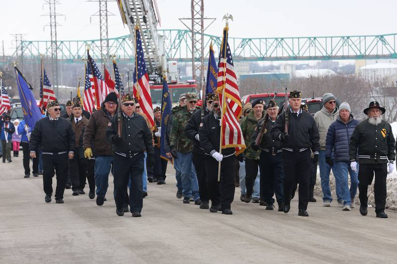 Veterans walk during the 46th annual Peal Harbor parade and Memorial service at the South Shore Boat Club in Peru.