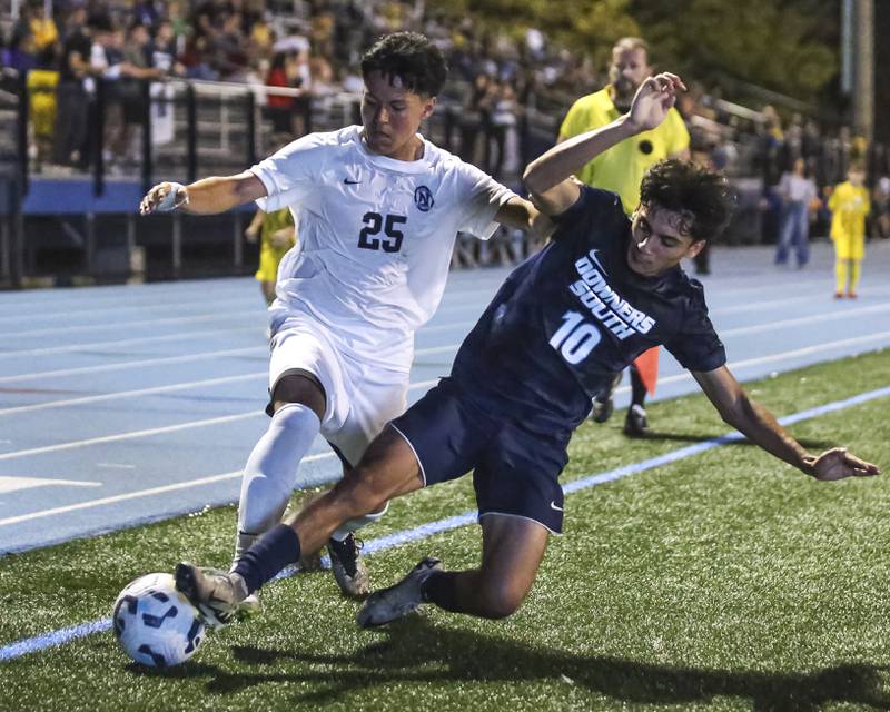 Downers Grove South's Omar Flores (10) defends Downers Grove North's Jose Duran (25) during soccer match between Downers Grove North at Downers Grove South. Oct 2, 2025.