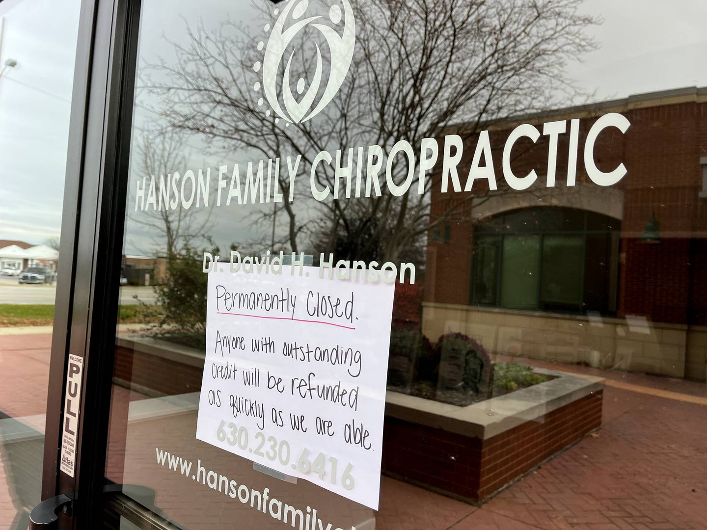 A sign on the entrance to the Hanson Family Chiropractic office, on Monday, Nov. 17, 2025 states the business is permanently closed. 
Chiropractor Dr. David H. Hanson was charged with multiple felony counts of producing, disseminating and possessing images of child sexual abuse, as well as three counts of video recording of children under age 18, and making an unauthorized video recording of patients at his Batavia office.