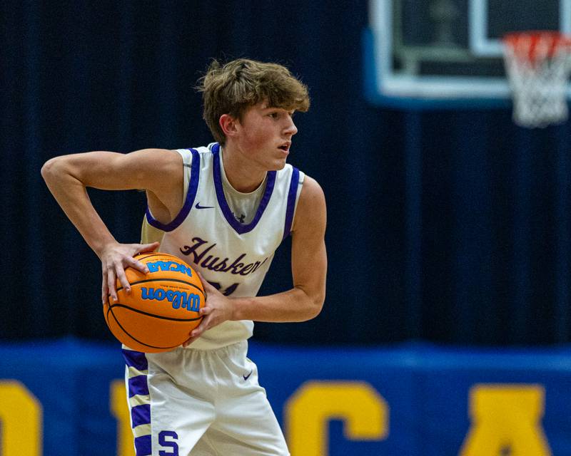 Ethan Stark (21) of Serena holds ball looking for open teammate in game against IMSA during the quarterfinals of the Little Ten Conference Tournament on Monday, Feb. 2, 2026 at Somonauk High School in Somonauk.