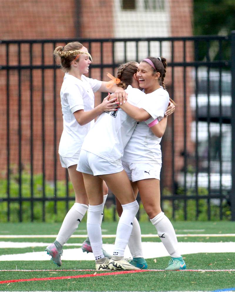 (Left to right) Wheaton Warrenville South's Kelsey Clousing, Ashlyn Adams and Lucy Jethani celebrate a goal during the Class 3A Glenbard West Sectional final against St. Charles North on Friday, May 30, 2025 in Glen Ellyn.